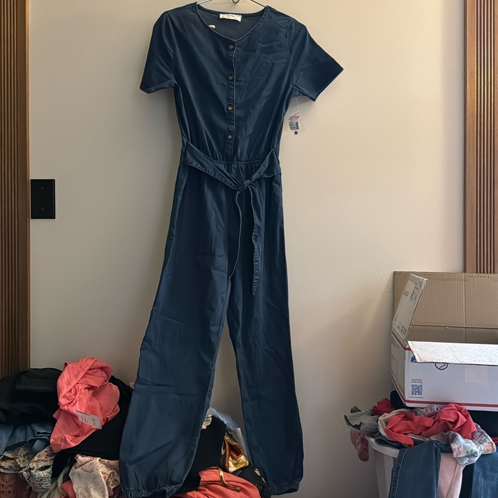 NWT!!! Evsie blue jumpsuit. Childs x large. Will fit a woman small.